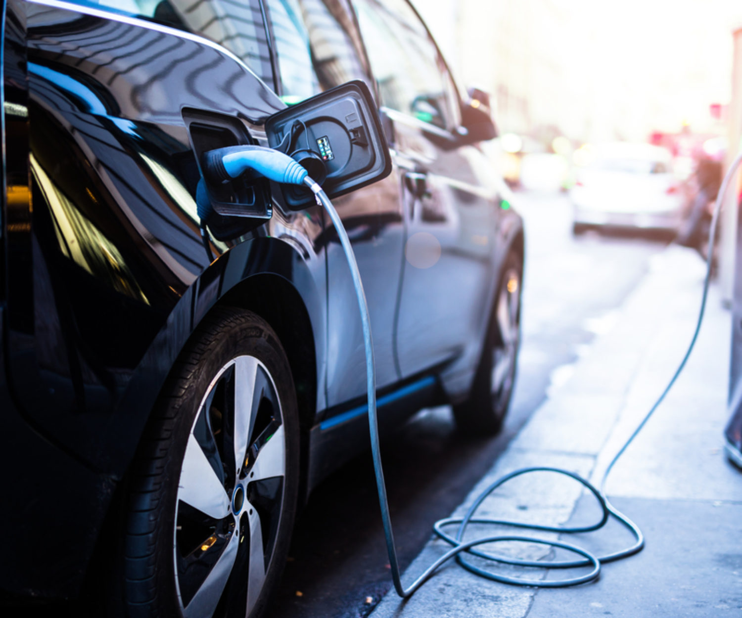 Charging modern electric car on the street which are the future of the Automobile